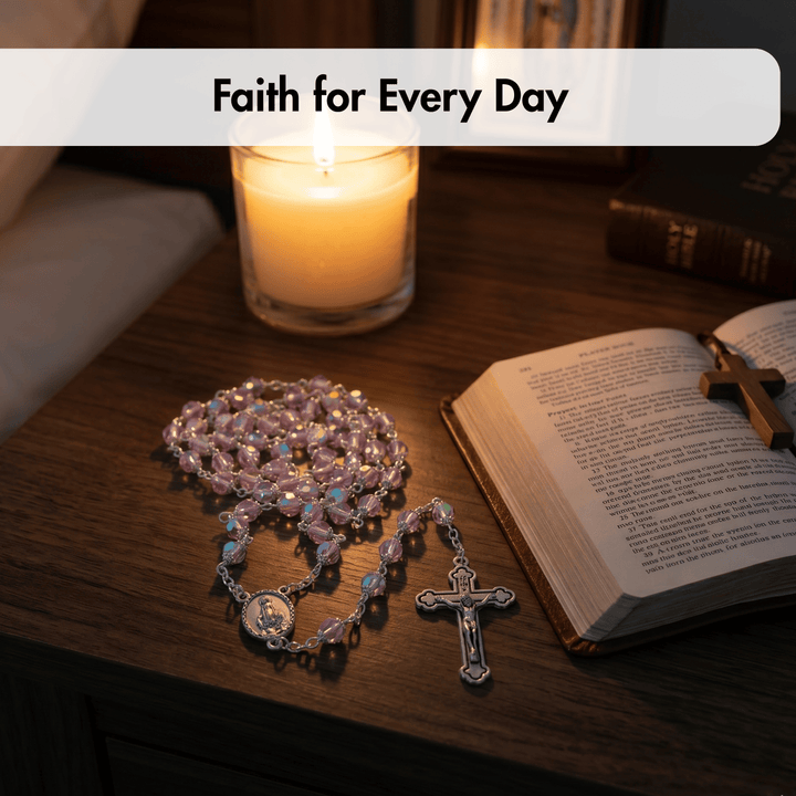 Open book with a cross, rosary, and lit candle on a wooden surface, labeled 'Faith for Every Day'.