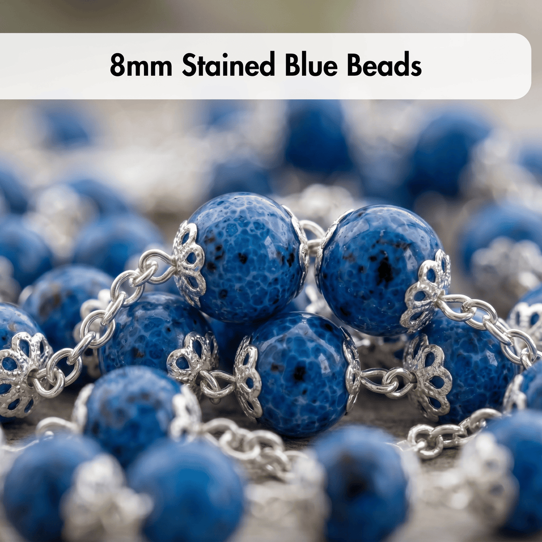 Necklace with blue beads and silver chain on a blurred background