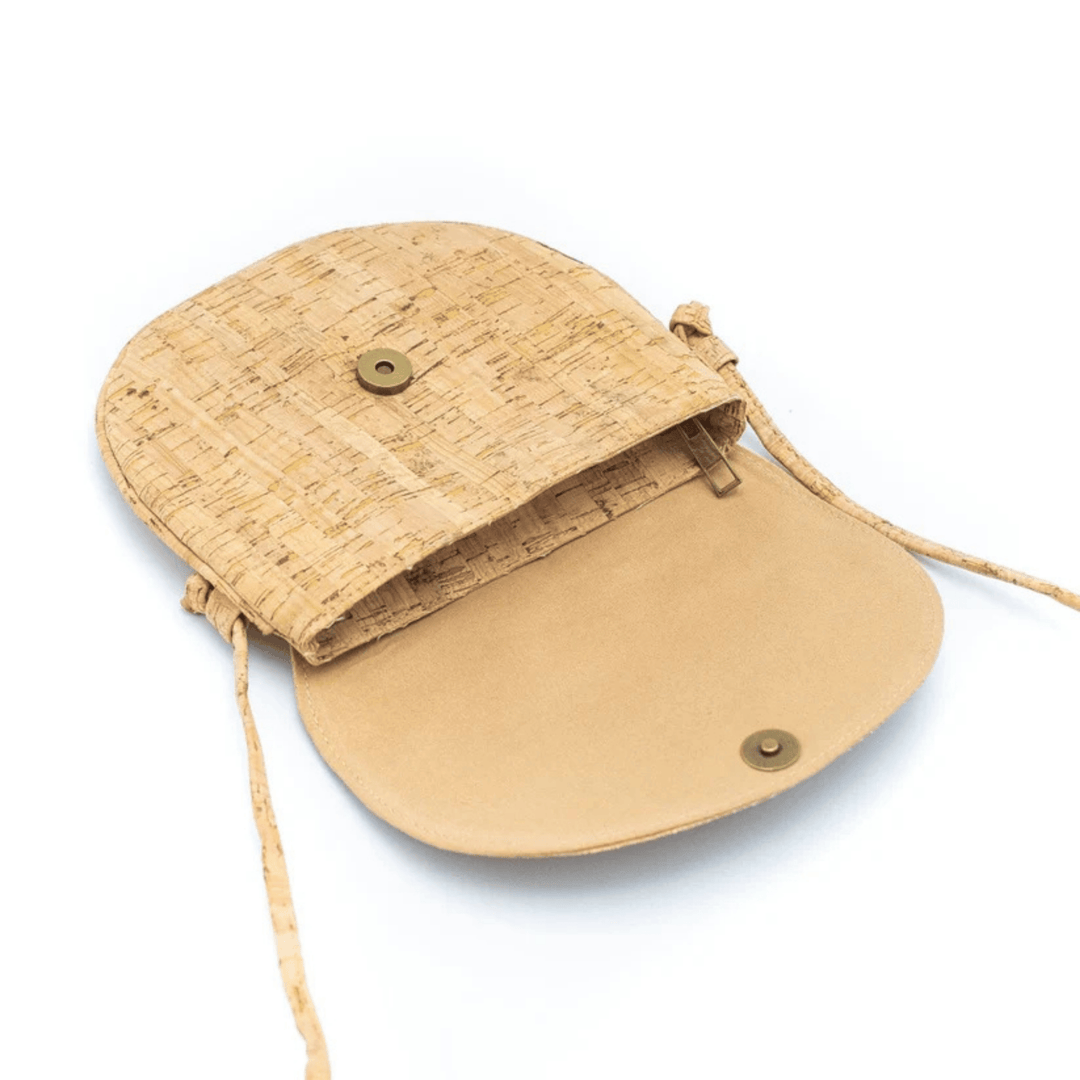 Beige cork handbag with a strap on a white background