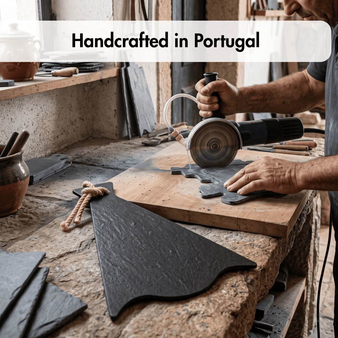 A person in a workshop uses a circular saw to cut a dark slate board on a wooden workbench. Other slate pieces, tools, and a rope accent are visible around the workspace, with a text overlay reading &