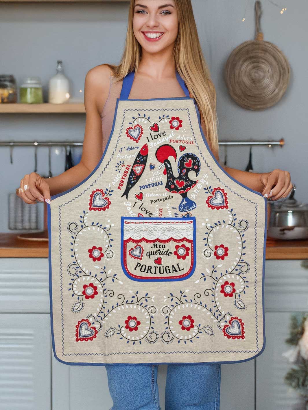 Woman wearing a decorative apron with rooster design in a kitchen setting