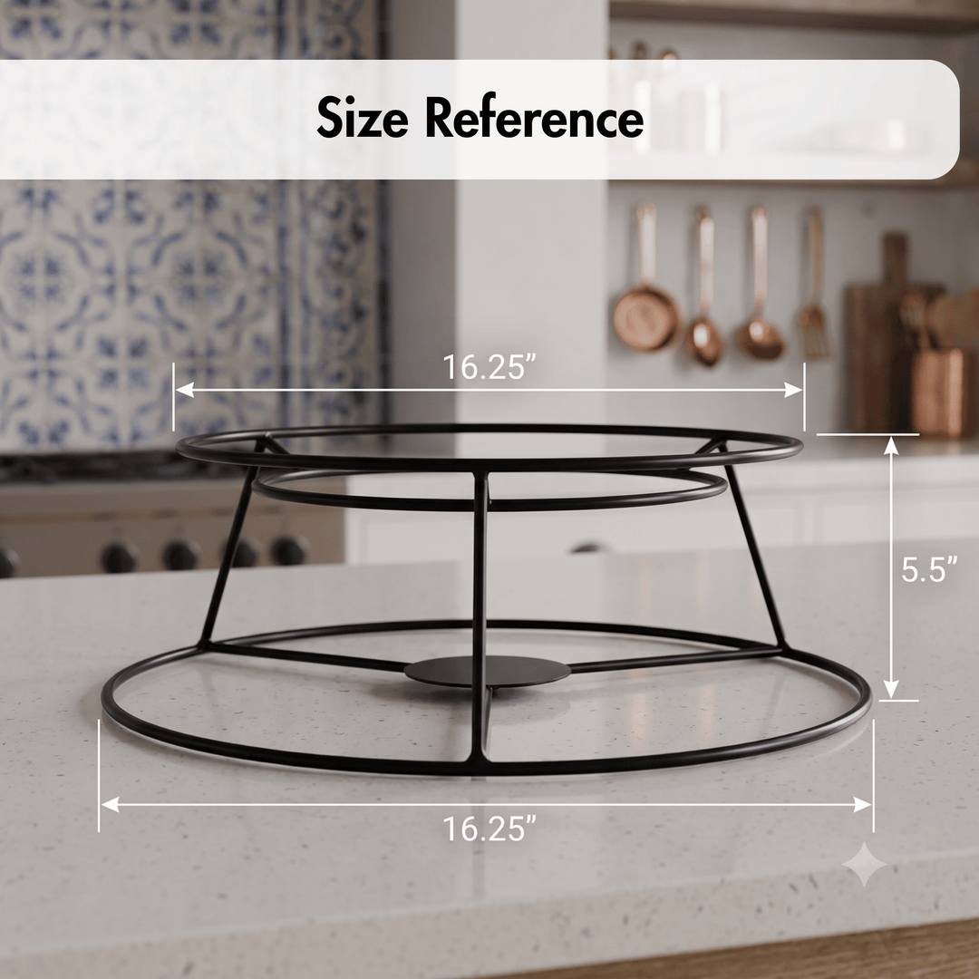 Black metal two-tier cake stand on a kitchen countertop with overlaid dimension lines showing 16.25 inches by 16.
