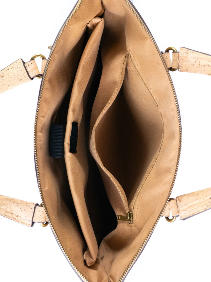 Tan leather handbag with a visible brand logo on a white background