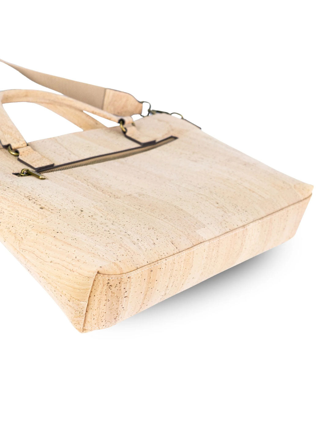 Beige cork handbag with a handle on a white background