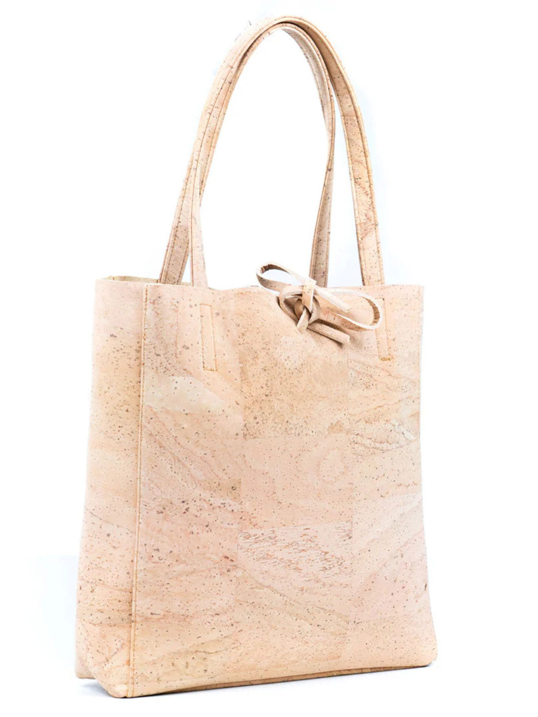 Beige cork tote bag with a bow on a white background