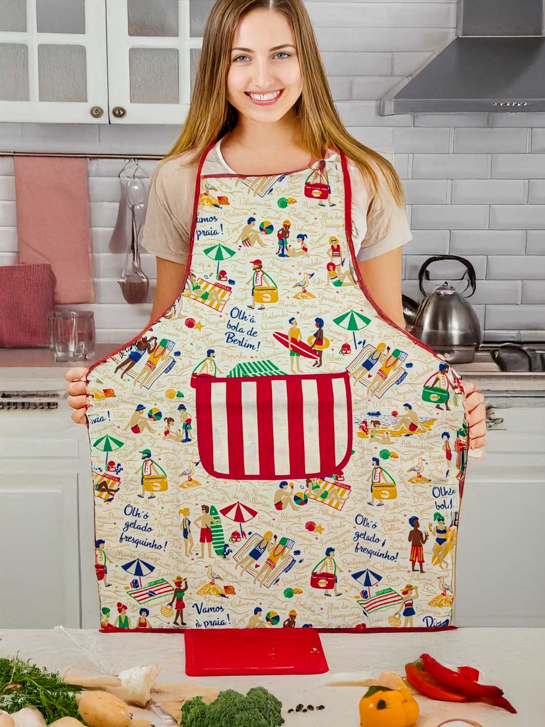 Woman wearing a colorful apron with a kitchen setting in the background