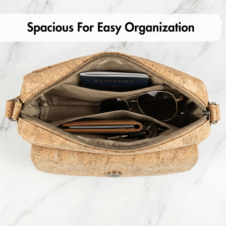 Open cork bag with items on a marble background, text 'Spacious For Easy Organization'.