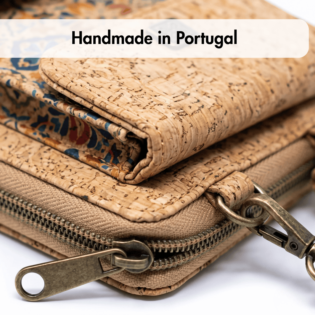 Cork wallet with brass zipper and clasp, labeled 'Handmade in Portugal'.