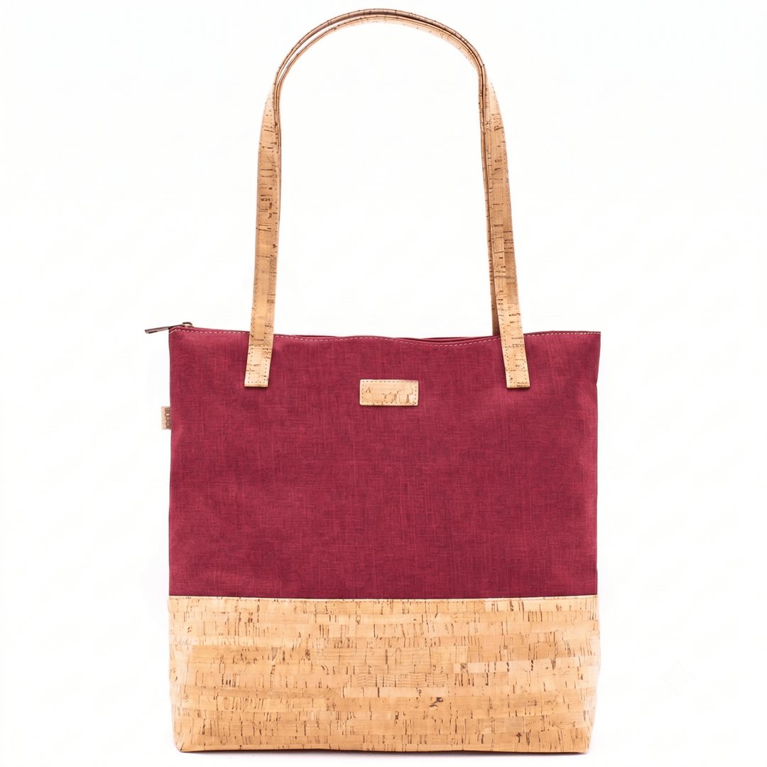 Red tote bag with cork accents on a white background
