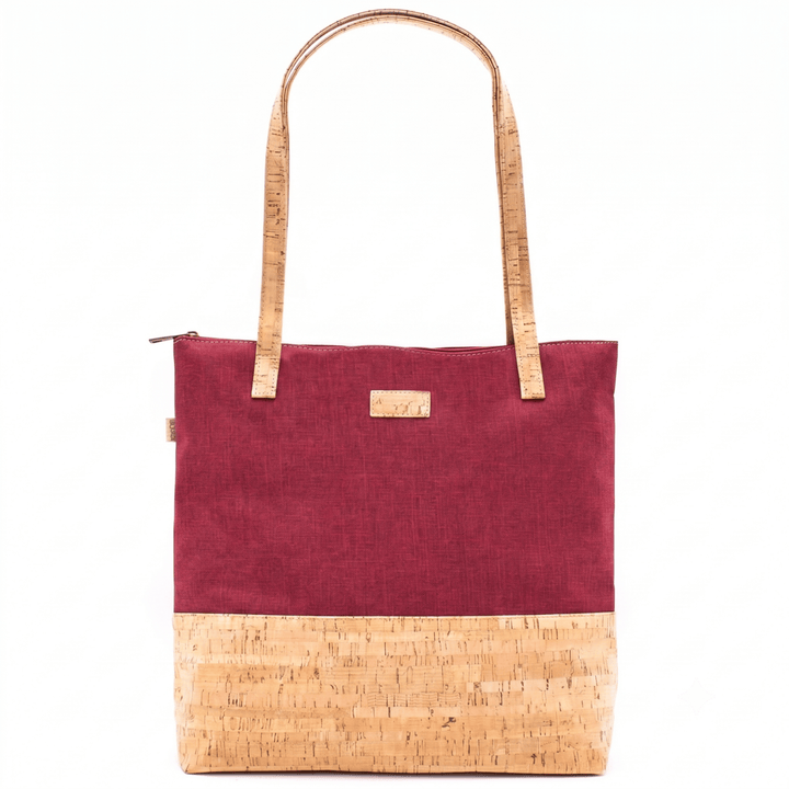 Red tote bag with cork accents on a white background