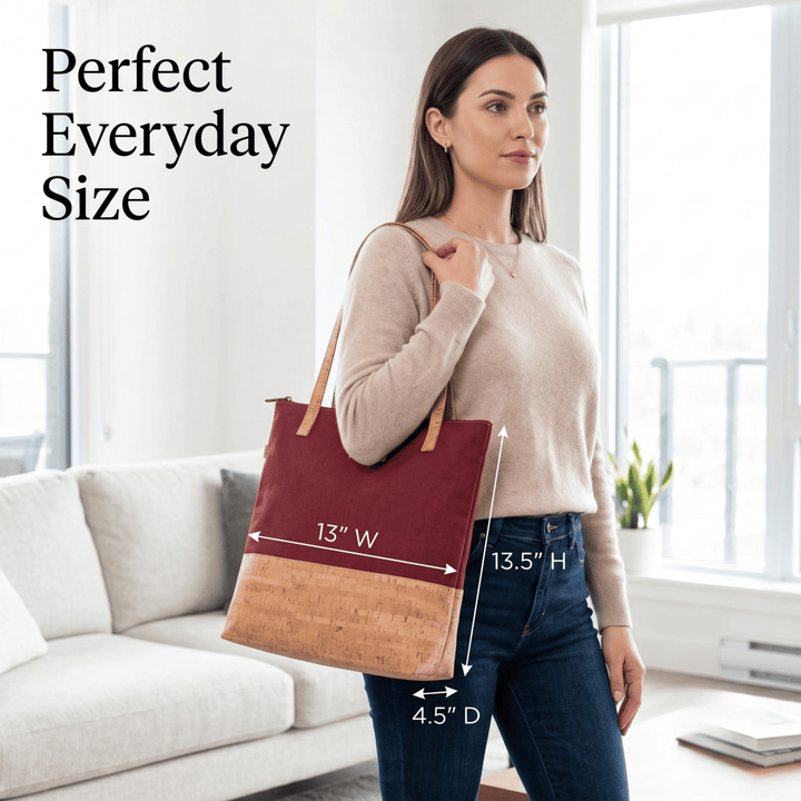 Woman holding a two-tone tote bag with measurements, standing in a bright room.