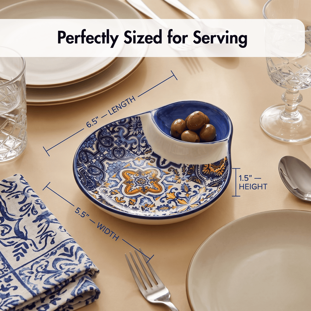 A decorative serving bowl with blue and yellow floral patterns, shown on a beige table setting with measurement callouts reading 6.5 inches length, 5.