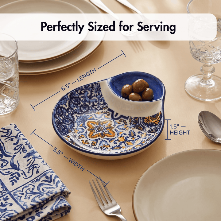 A decorative serving bowl with blue and yellow floral patterns, shown on a beige table setting with measurement callouts reading 6.5 inches length, 5.