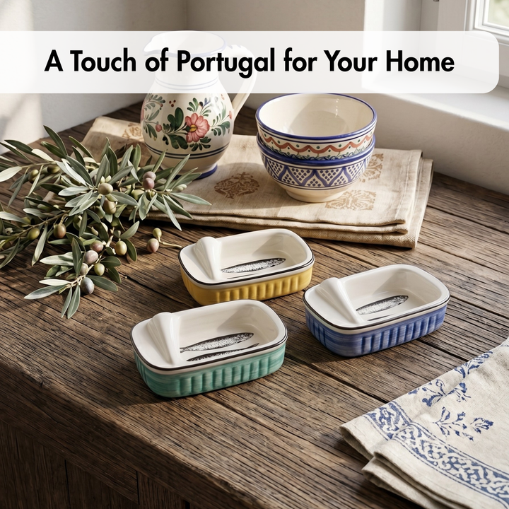 Four small rectangular ceramic fish dishes in mint green, yellow, and blue are arranged on a rustic wooden table, alongside stacked patterned bowls, a floral pitcher, olive branches, and folded napkins. A text banner at the top reads, &