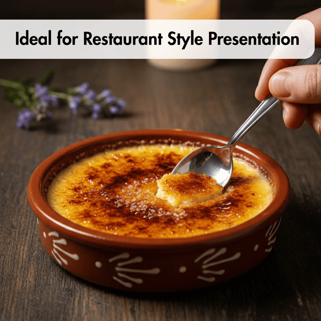 A close-up of a dessert in a brown ceramic bowl with white decorative patterns, topped with a caramelized crust, with a hand holding a spoon over it on a dark wooden table. A text banner at the top reads &