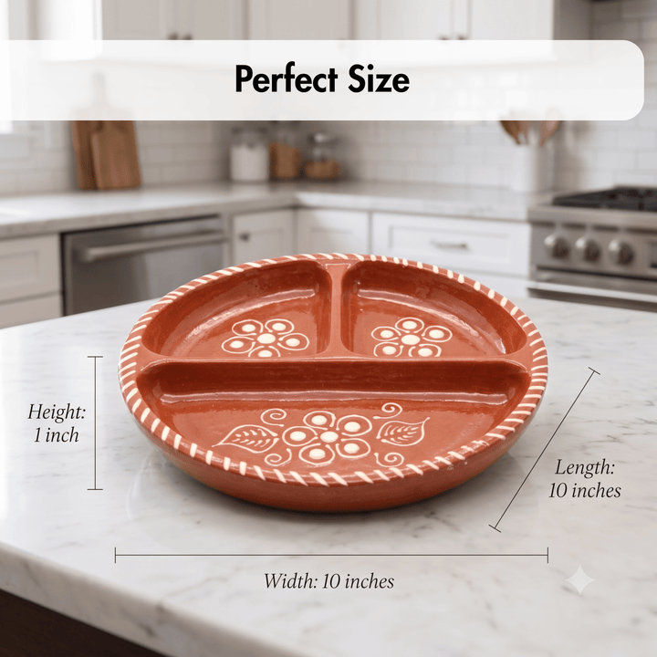 A terracotta-colored three-compartment ceramic serving platter with white floral patterns and a white rope-style rim, shown on a kitchen countertop with overlaid dimension labels reading 10 inches width, 10 inches length, and 1 inch height.