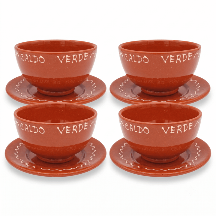 Four terracotta-colored ceramic teacups with matching saucers, each printed with the words &