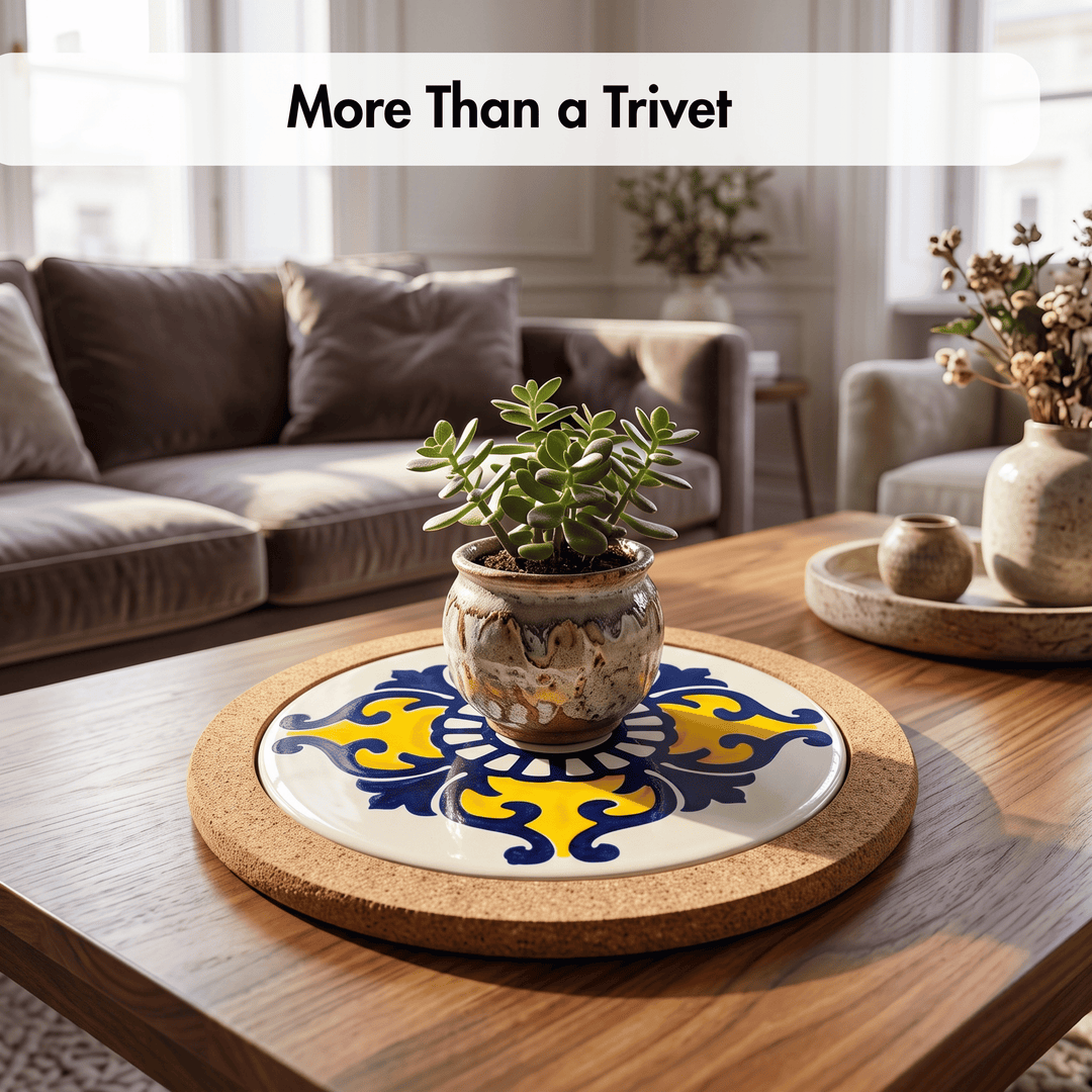 A round cork trivet with a decorative ceramic tile insert, styled on a wooden coffee table with a small potted succulent in a living room setting.