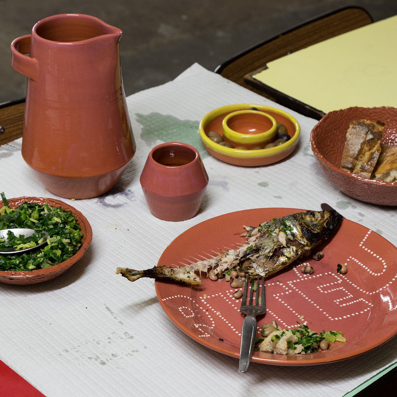 Traditional Portuguese terracotta clay tableware with a modern design.