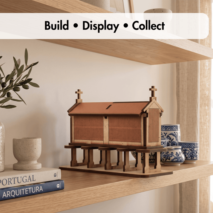 A wooden architectural model of a Japanese temple or shrine is displayed on a light wood shelf, surrounded by decorative books, ceramic cups, and a potted olive branch. A white banner at the top reads &