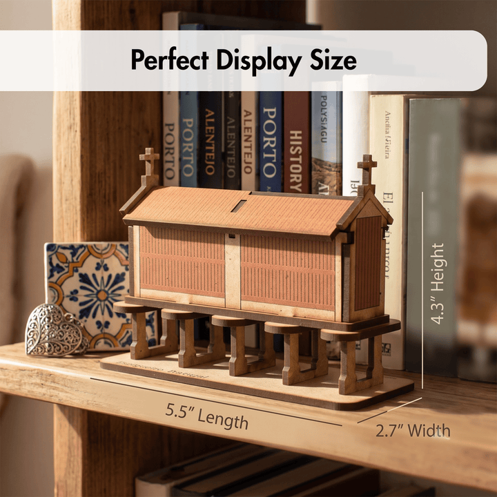 A wooden church model displayed on a wooden shelf, with overlaid dimension labels showing 5.5 inches length, 2.