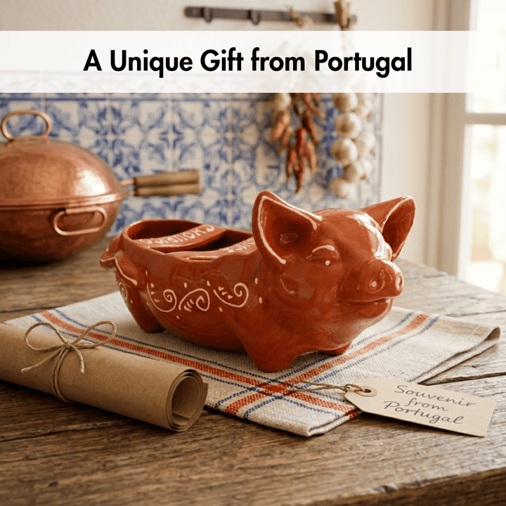Ceramic pig-shaped container on a table with a tag indicating it's a souvenir from Portugal.