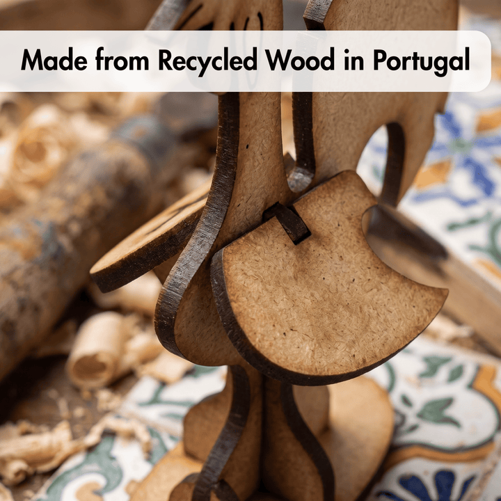A close-up of a wooden decorative object made from layered recycled wood slices, with a text banner reading &