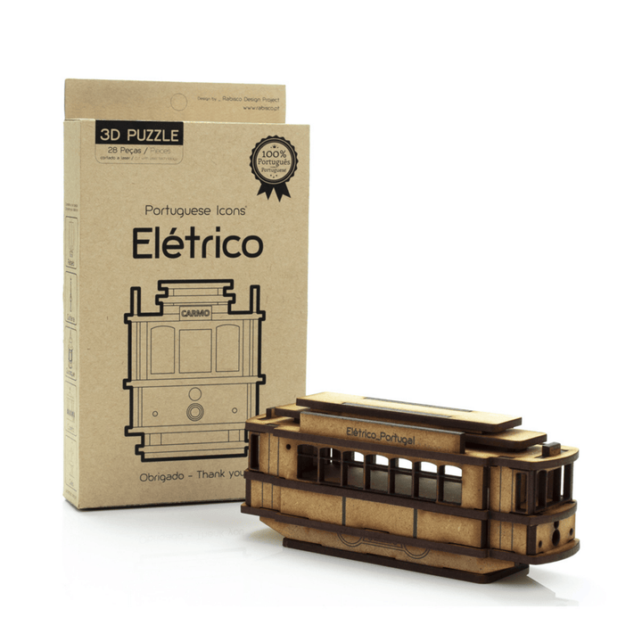A wooden 3D puzzle model of an electric streetcar, shown next to its brown cardboard packaging box on a clean white background.