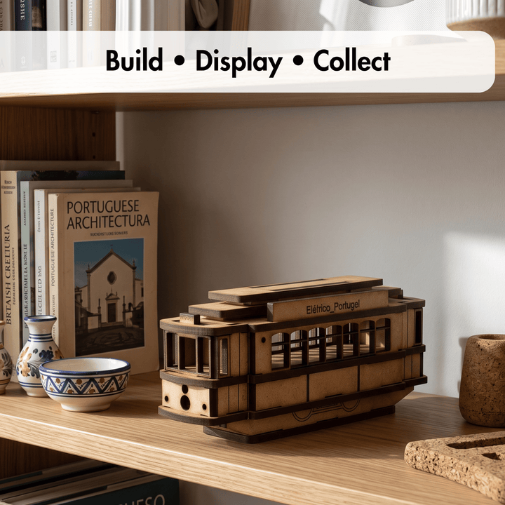 A wooden model of a vintage electric tram labeled &