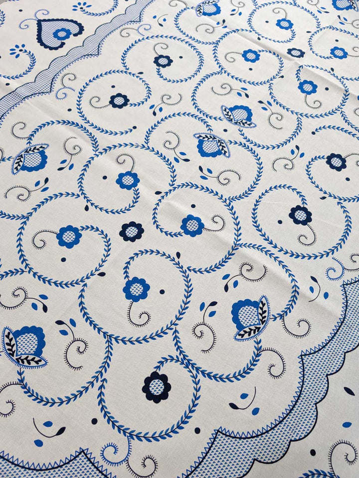 Close-up of a blue and black floral pattern on a white background