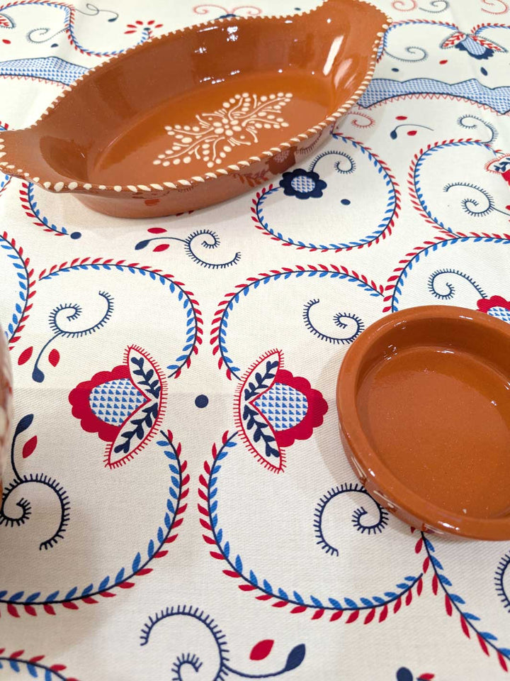 Ceramic bowls on a tablecloth with decorative patterns