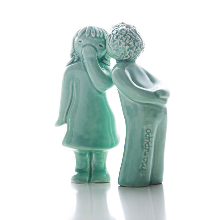 These precious handmade ceramic collectible figurines are the perfect way of telling someone how much you care. The set is composed by 2 figurines: a boy giving a kiss, and the girl who receives it, creating a unique decorative ornament for your home to display on a shelf, coffee table or mantel.