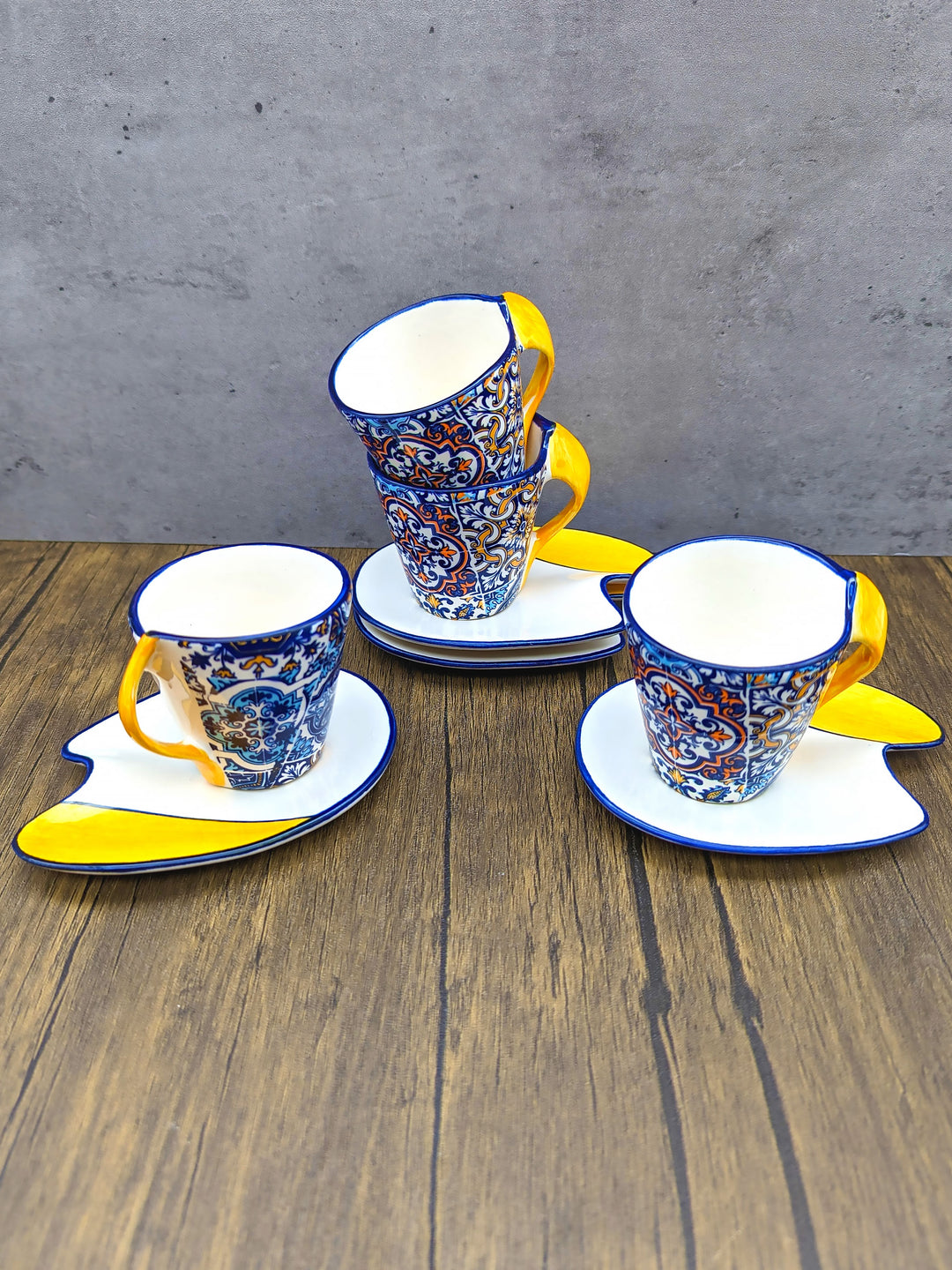 https://weareportugal.com/cdn/shop/products/Portuguese-Pottery-Alcobaca-Ceramic-Hand-Painted-Coffee-Espresso-Cup-Set-of-4_13.jpg?v=1672461803&width=1080