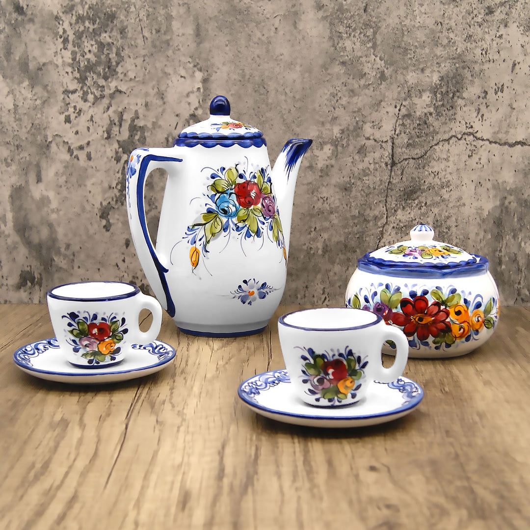https://weareportugal.com/cdn/shop/products/Portuguese-Pottery-Alcobaca-Ceramic-Hand-Painted-Serving-Coffee-Pot_2.jpg?v=1636845534&width=1080